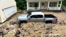 Truck buried in debris after flash floods