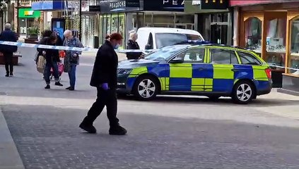 Scene of crime officers examine area of High Street, Kettering