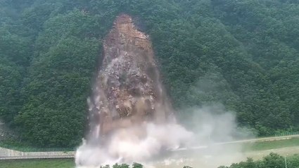Landslide engulfs mountain road as heavy rain pummels South Korea