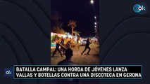 Batalla campal: Una horda de jóvenes lanza vallas y botellas contra una discoteca en Gerona