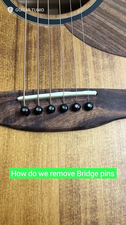 Instructions for removing Bridge pins in guitar