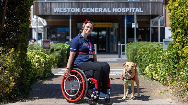Nurse who uses wheelchair becomes first to have assistance dog at work