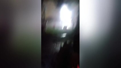 Moment lightning strikes meters away from woman in China