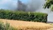 Watch billowing smoke after combine harvester catches fire on A29 and spreads to field