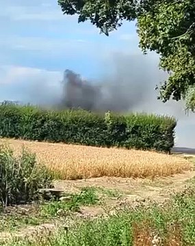 Watch billowing smoke after combine harvester catches fire on A29 and spreads to field
