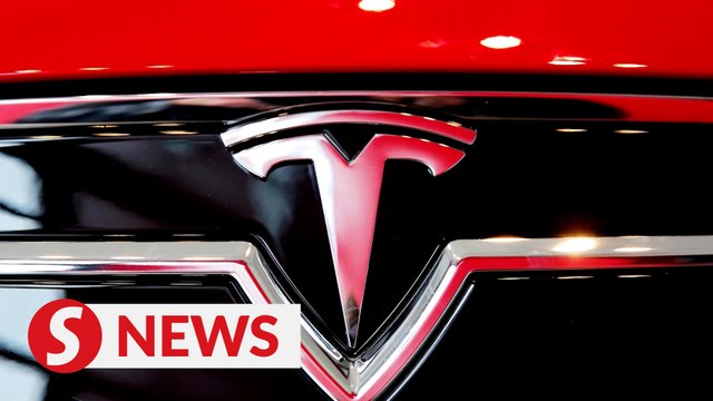 Tesla, Netflix pull Nasdaq and S&P lower, Dow ends higher