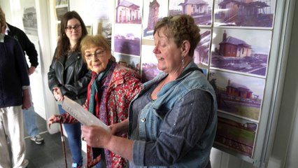 Jenny Szyfelbain reads a poem at Thrumster historic railway station