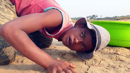 Amazing Hand Fishing Video _ Traditional Boy Catching Fish By Hand Dry Place In River Side _ Fishing
