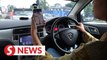 No one-size-fits-all rules, says Loke on distracted driving