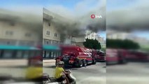 Antalya'da çıkan yangında balkonda mahsur kalan kadını itfaiye kurtardı
