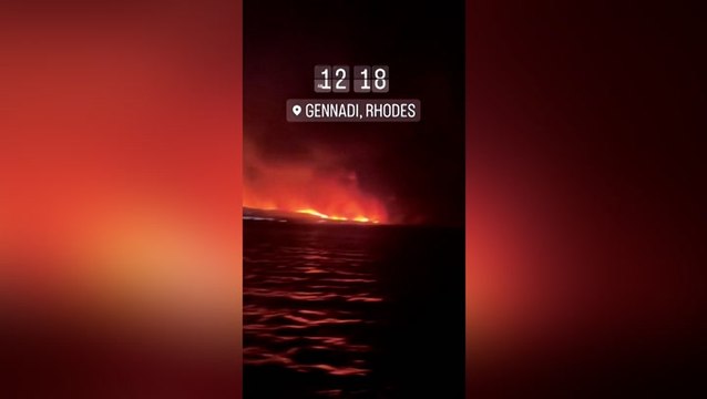 Tourists evacuated by boat from Rhodes as wildfire rages on Greek island