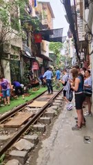 Couple Visit Hanoi's Famous Train Street