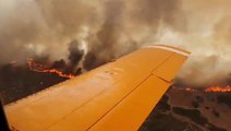 Aircraft tackling Greek wildfires flies through thick smoke in apocalyptic scenes