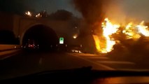 Flames get inches from cars going into tunnel on Italian highway
