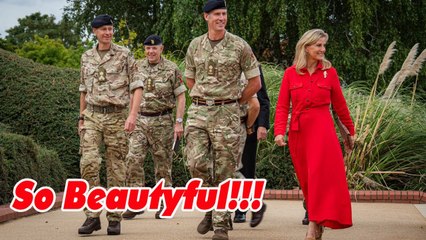Duchess Sophie's blonde hair pops in in silhouette skimming scarlet shirt dress