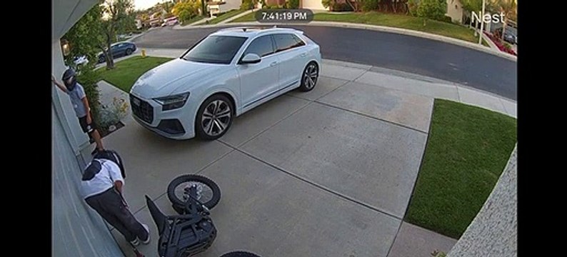 Kid Drives Dirt Bike Into Garage Door