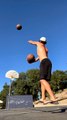Guy Balancing on Slackline Makes Basketball Trickshots While Stabilising Bottle Over His Head