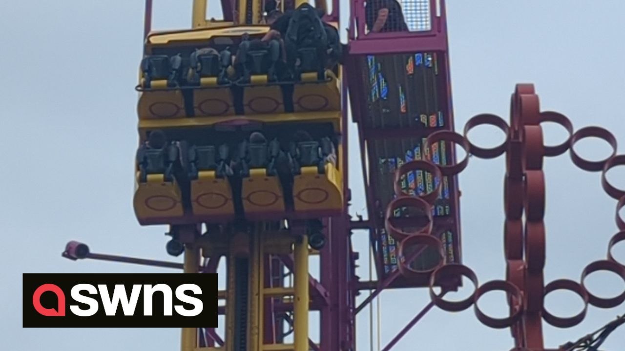 Rescuers scramble to aid people stuck at top of 22-metre rollercoaster