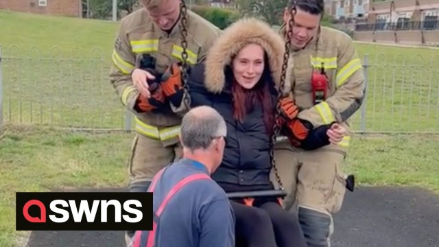 Mum had to be rescued by firefighters who cut her out of baby swing after getting stuck in it for an hour