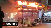 New Yorkers ignore hotdog stand as it becomes engulfed in flames