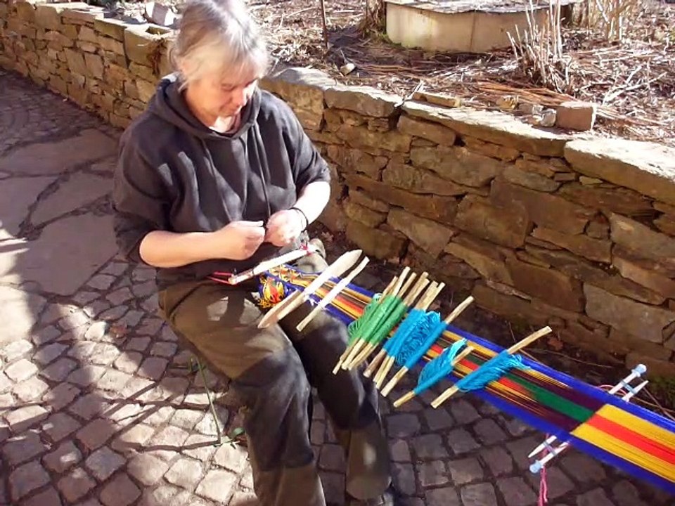 Weaving a sara belt with 14 heddles on a backstrap-loom