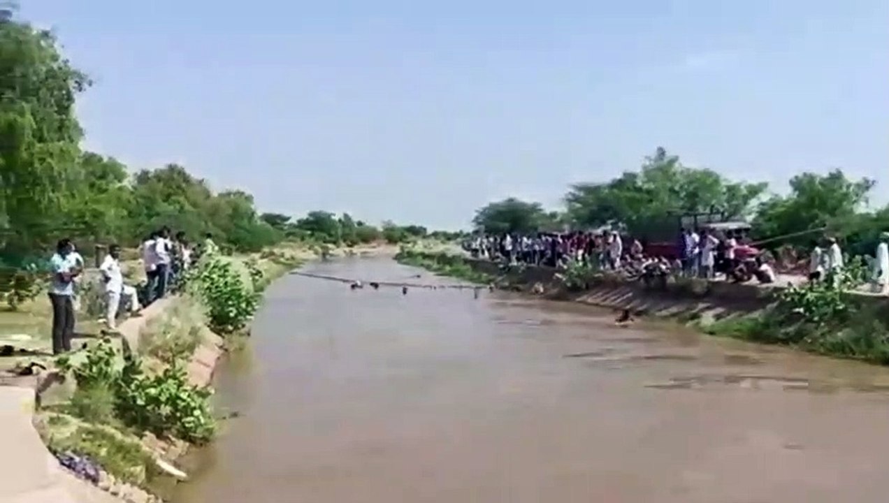Seeing the young man drowning, the villagers ju...