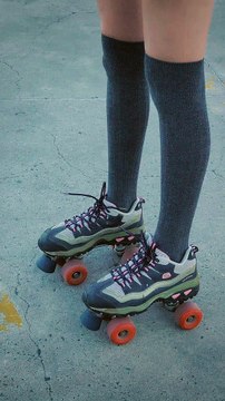 mixkit-girl-with-roller-skates-standing-in-the-middle-of-a-34545