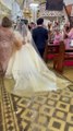 Watch: Bride wades through flooded aisle in wedding dress, video goes viral