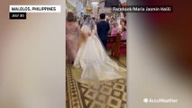 Bride walks down flooded aisle after Typhoon Doksuri