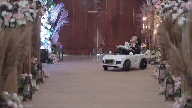 Toddler chosen as ring bearer falls asleep while riding toy car down aisle