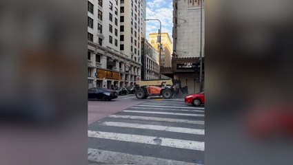 Suspect takes forklift for joy ride in downtown Los Angeles before crashing into theatre
