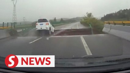 Car drives into crater amid severe weather in China