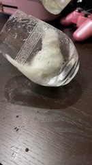 Bird Takes a Bath in a Glass