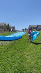 Woman Bellyflops Off Slip-and-Slide