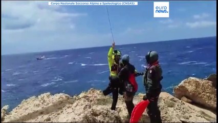 Migrants rescued after clinging to rocks near Lampedusa for days