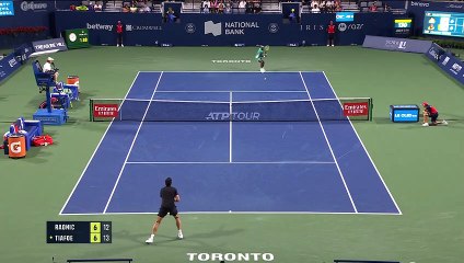 Tiafoe wins first set against Raonic after rare net touch winner