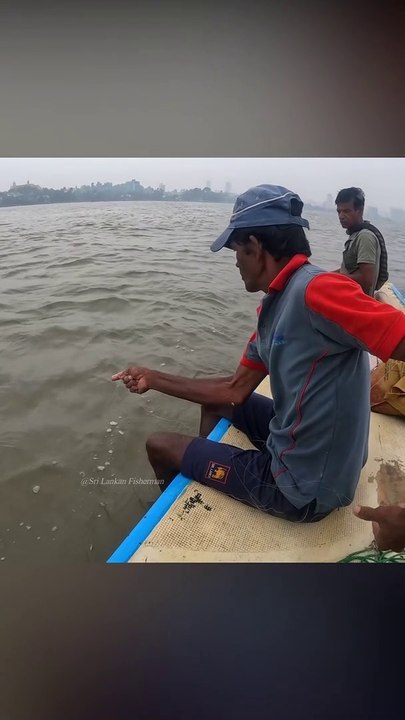 Fisherman working hard to catch this fish