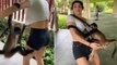 Really cheeky! Watch dogged spider monkey climb on to US tourist pull her t-shirt down and cling on despite her hilarious efforts to disentangle