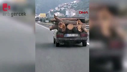 Otomobille tehlikeli odun taşıma