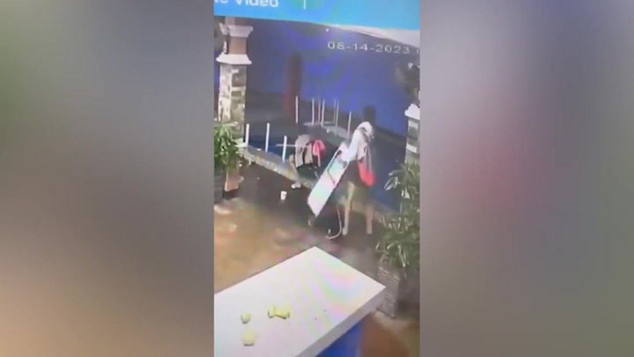 Hotel guests throwing furniture into pool caugh...