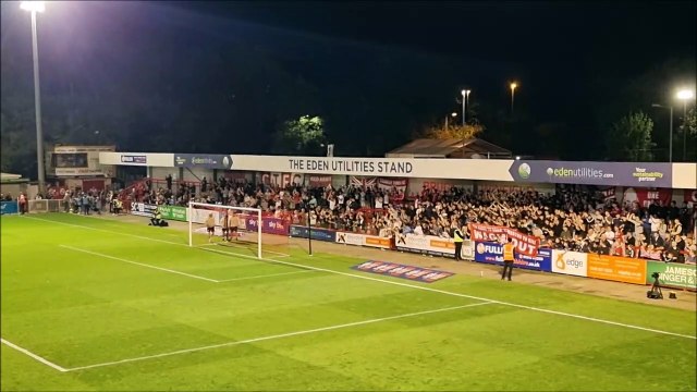 Crawley Town manager Scott Lindsey celebrates with fans after beating MK Dons 2-1