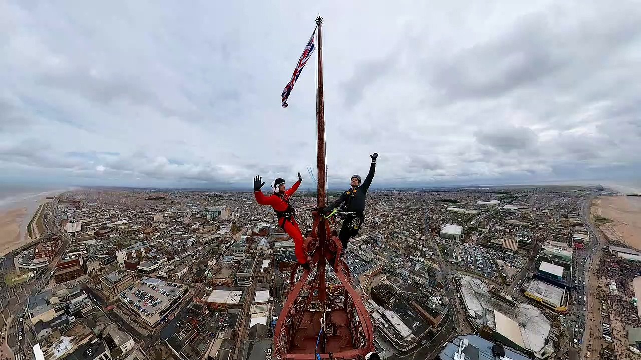 Two thrill-seekers scaled the 518ft Blackpool Tower for stunning selfie with Red Arrows