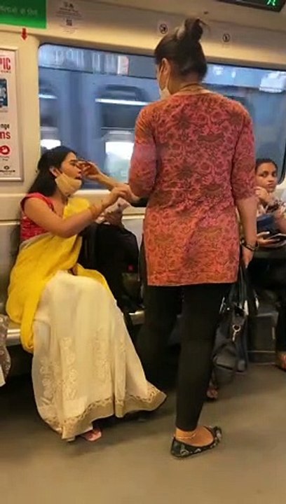 Indian women fighting for Metro's  seat.......