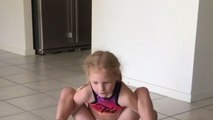 Young gymnast girl bumps her head on the floor during gymnastic routine *Hilarious*