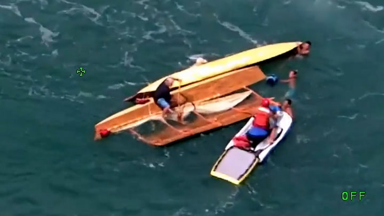 Aerial footage shows moment 11 people are rescued from sea after boat