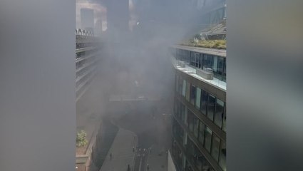 Smoke fills air near central London tube station as firefighters battle blaze in city