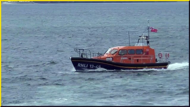 Dolphins swim with Whitby's new Shannon Class lifeboat
