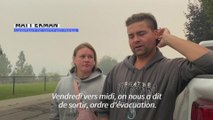 Des habitants évacués dans le sud-ouest du Canada inquiets face à l'avancée du feu