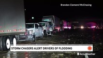 Storm chaser alerts drivers stuck on interstate of approaching flash flooding