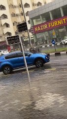 Garbage Drum Floats Down Street In Heavy Rain